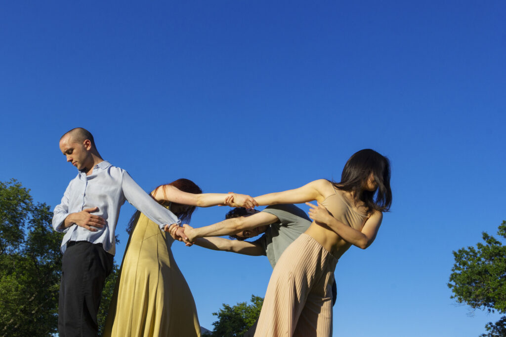 A group of dancers forming a circle