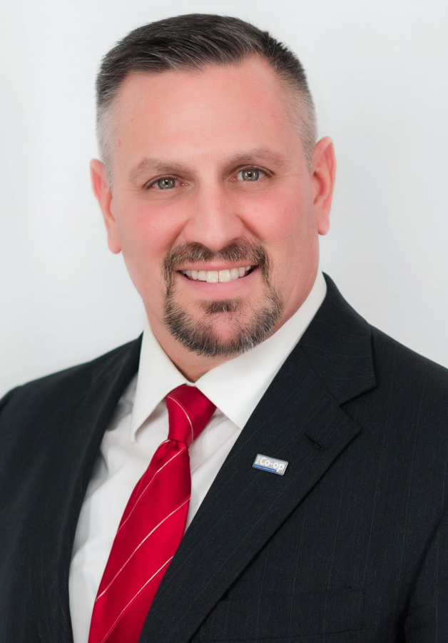 man in dark suit with red tie